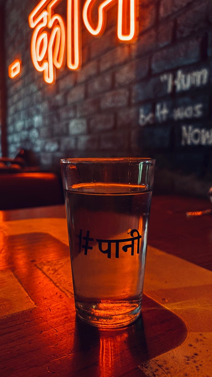 Water glass under neon