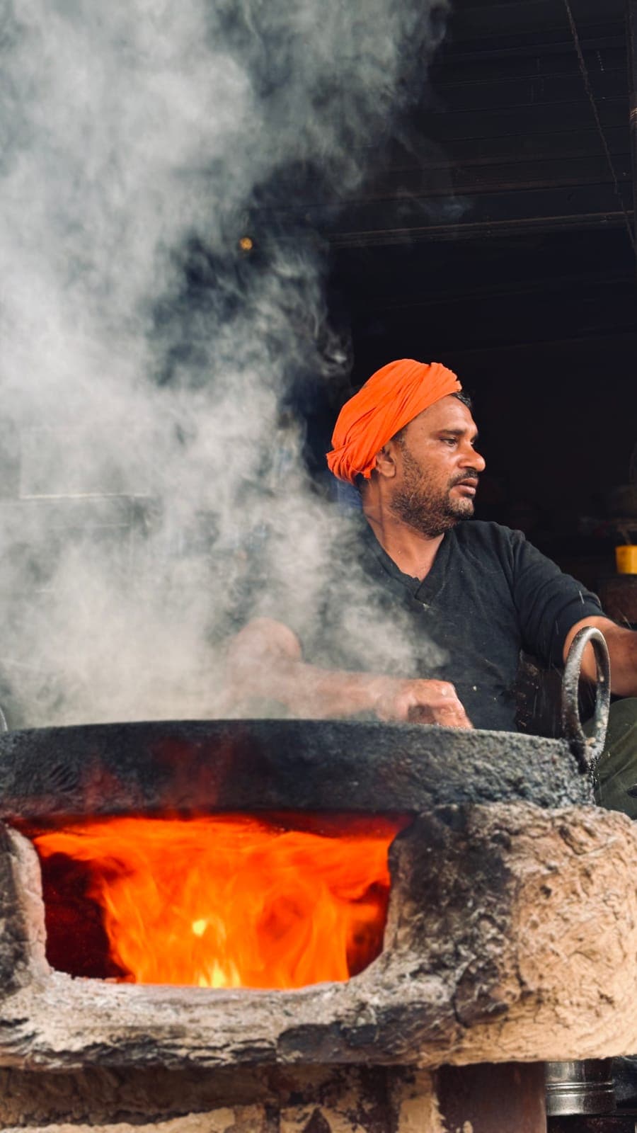 Cook at the fire